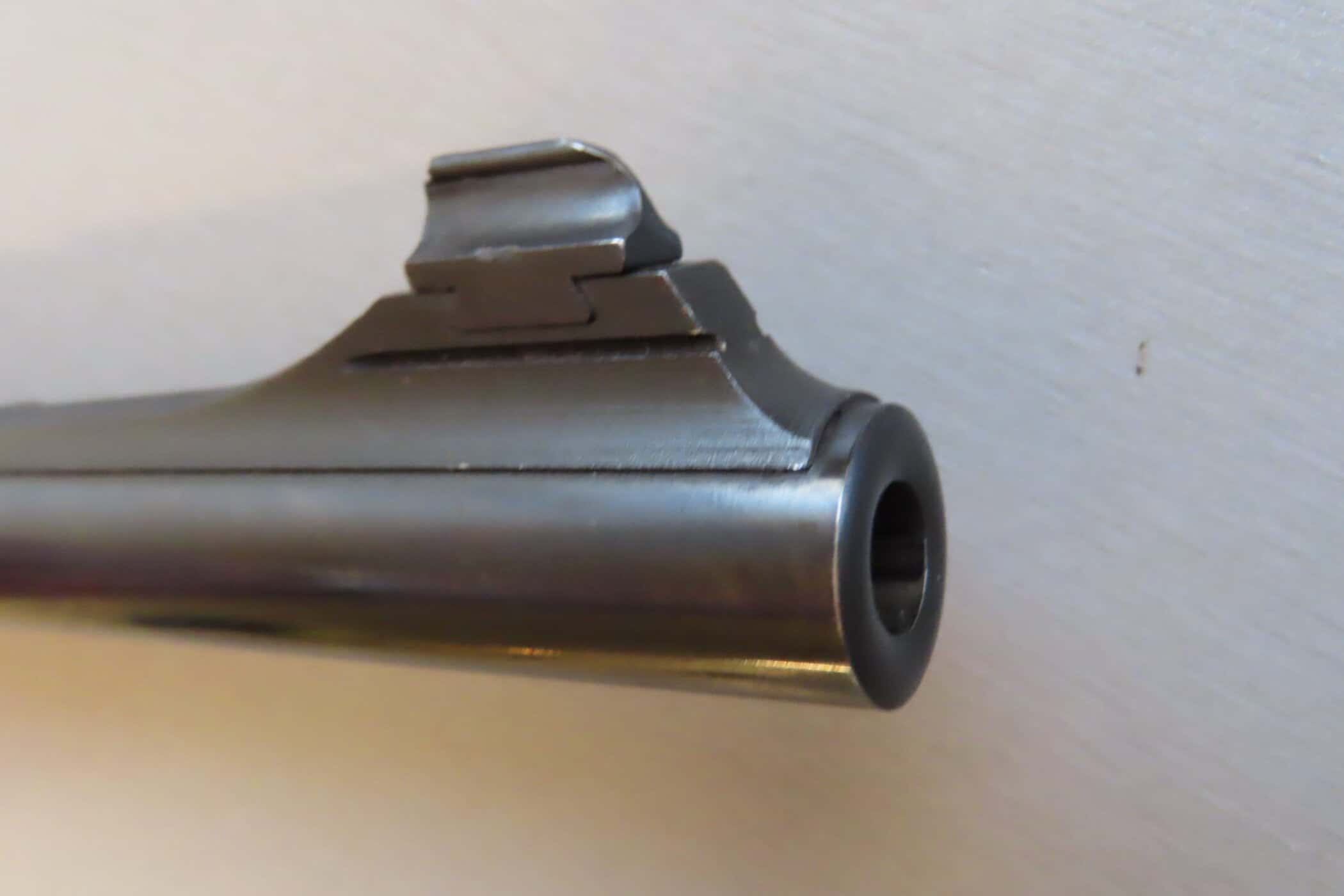 Detailed image of a classic rifle barrel highlighting historical firearm craftsmanship.