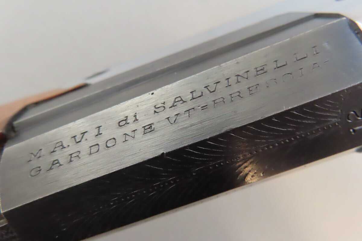 Vintage firearm ammunition engraving detail.