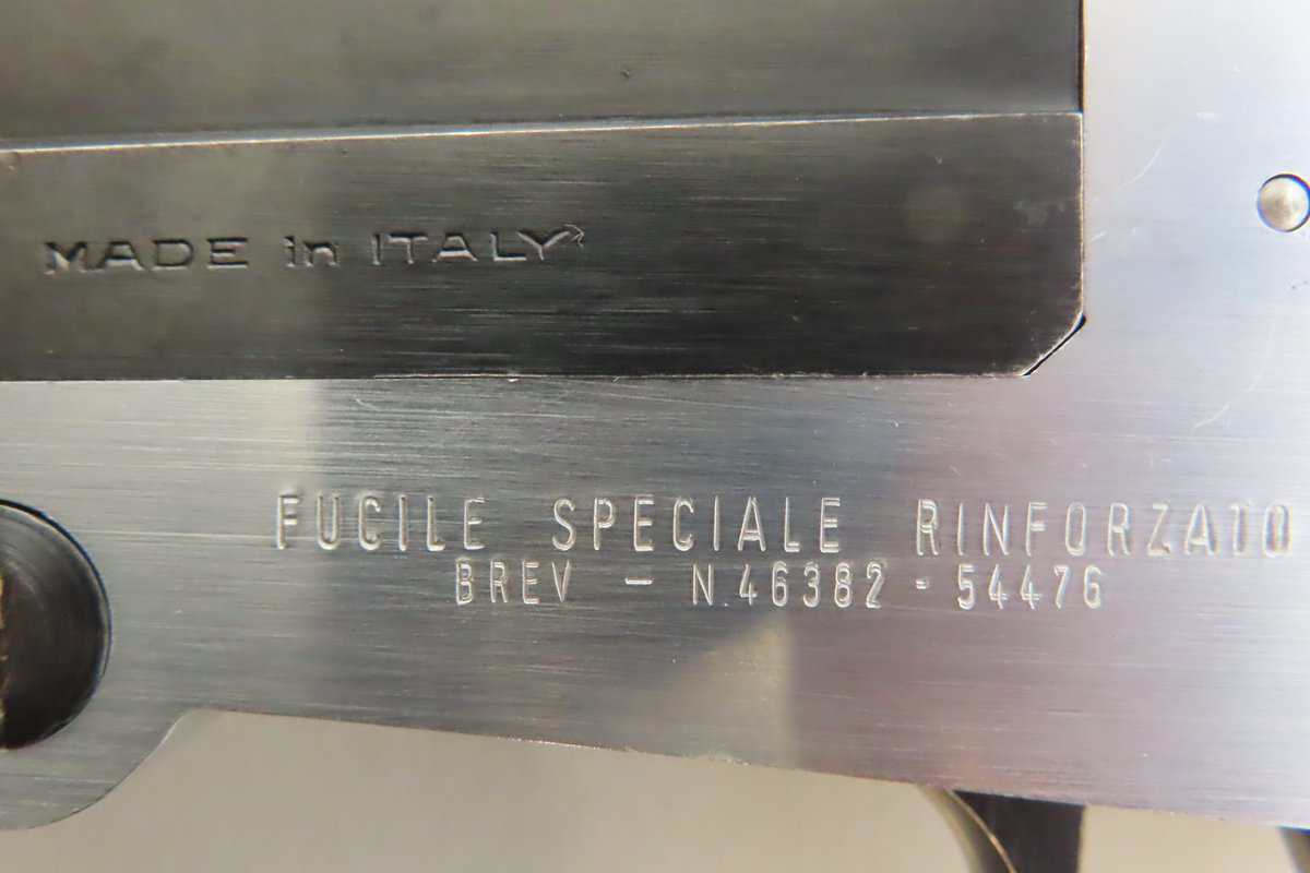 High-quality Italian firearm part with engraved markings, emphasizing craftsmanship and reinforcement.