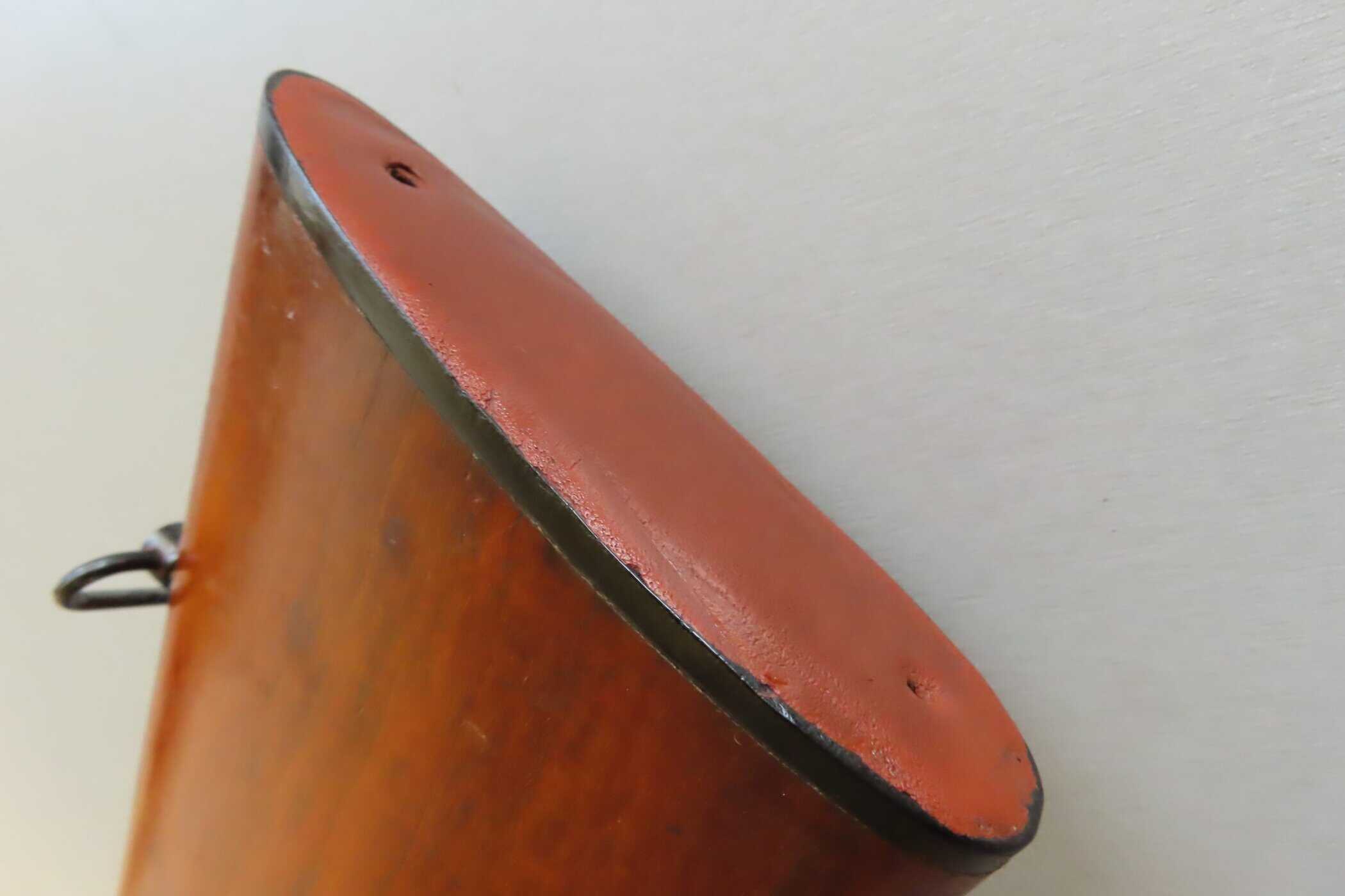 Alt: Close-up of a historic, rusty ammunition box lid from Colonial Ammunition Company, NZ.