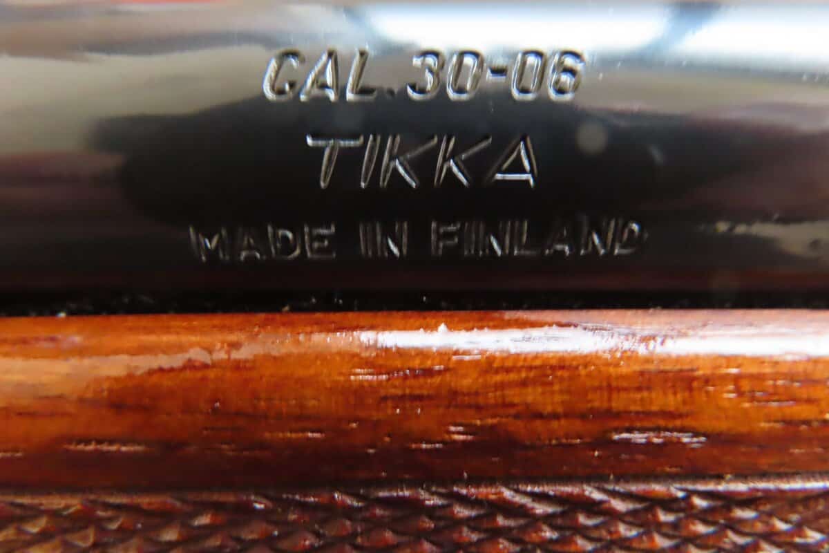 Finnish-made firearm with vintage markings, showcasing polished wooden stock and metal details.