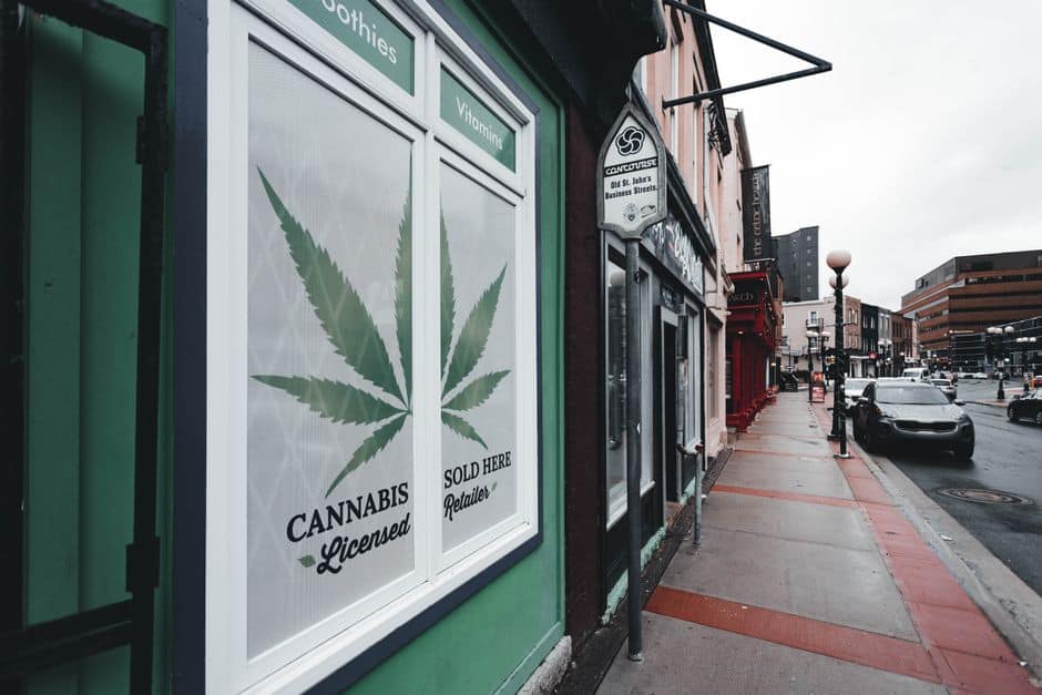 Cannabis retailer sign on city street