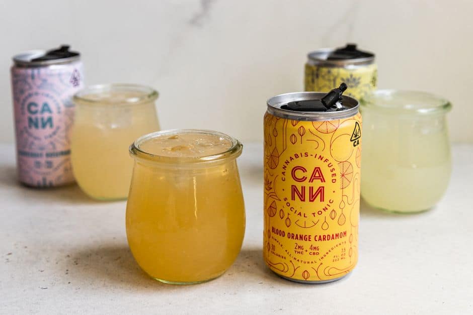 CANN drinks and glasses with yellow liquids