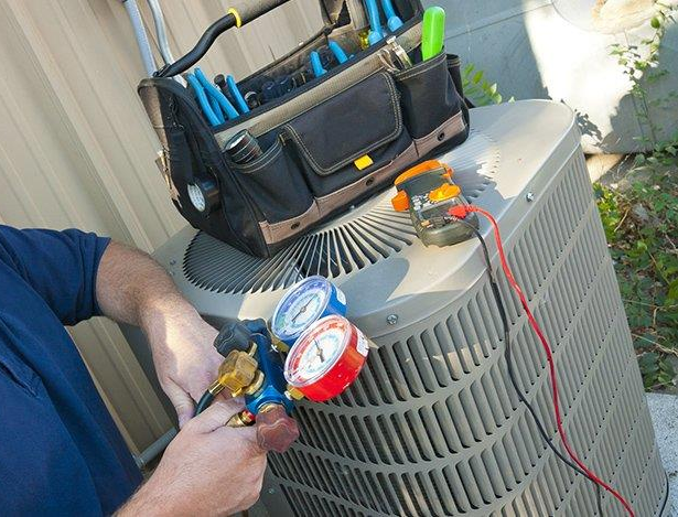 HVAC-Technician-Checking-AC-Condenser-Refrigerant-Pressure