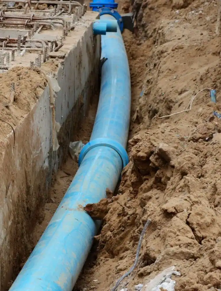 Blue-Water-Main-Pipe-Installation-In-Deep-Trench