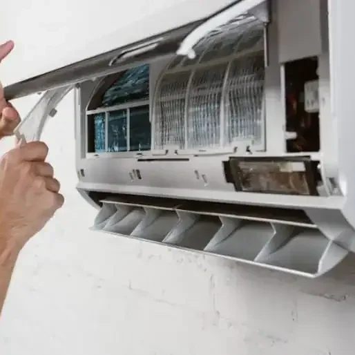 Technician-Opening-Air-Conditioner-Panel-For-Service