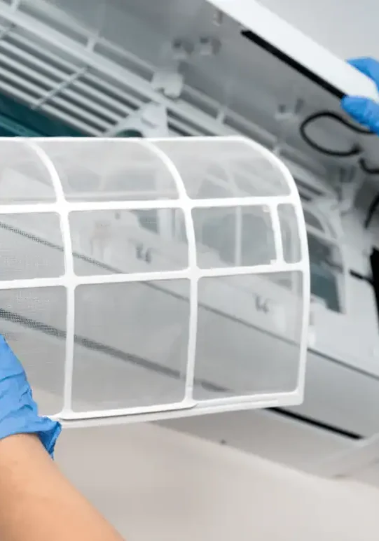 Technician-Removing-Indoor-Air-Conditioner-Filter-For-Cleaning