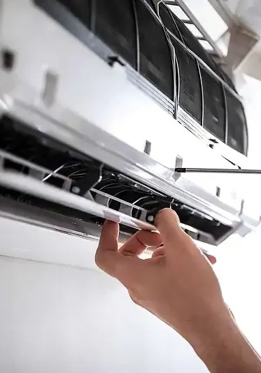 Technician-Inspecting-Wall-Mounted-Air-Conditioner-Unit