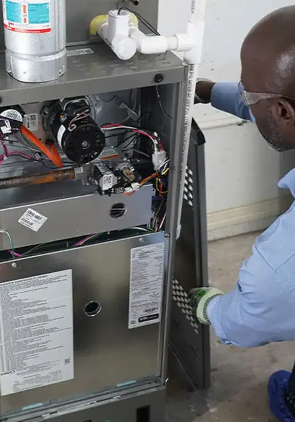 Furnace-Repair-Technician-Inspecting-Gas-Furnace-Components