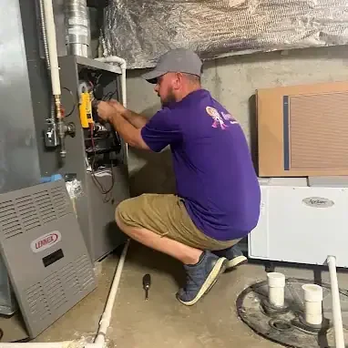 Home-Heroes-Plumbing-Heating-And-Air-Technician-Servicing-Lennox-Furnace