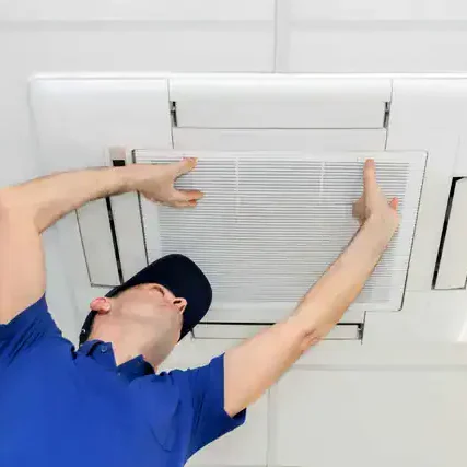 HVAC-Technician-Replacing-Ceiling-Air-Vent-Filter