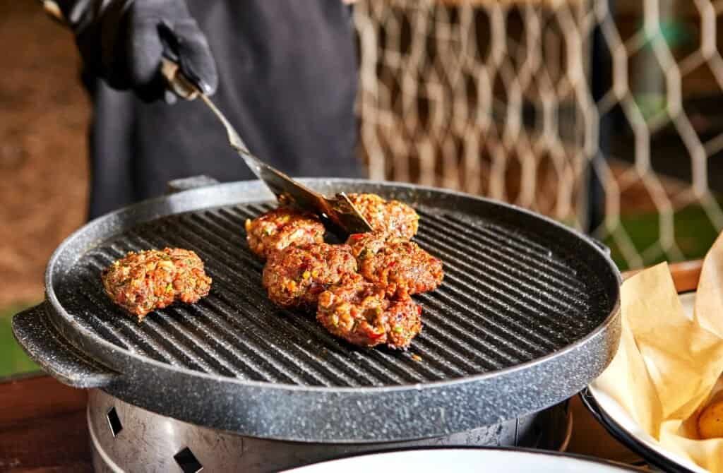 Free Carnivore Diet Recipes: Grilled Meat Patties Sizzling on the Grill