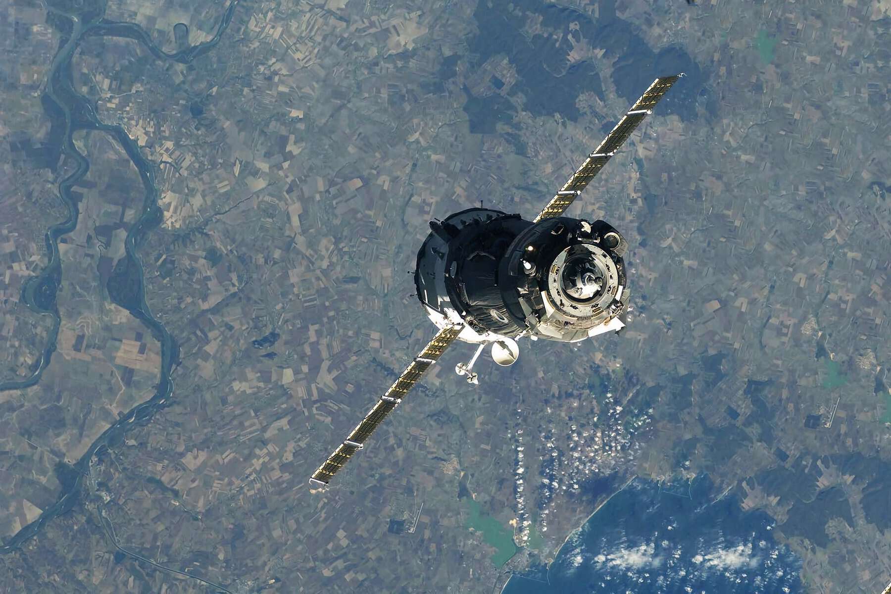 Image of an earth observation satellite orbiting the earth