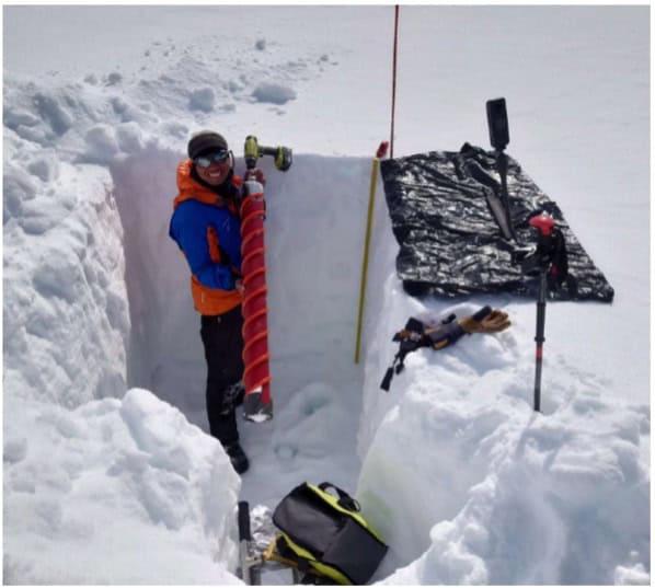Mr. Wilson Cheung, a PhD candidate at Queen’s University, extracting core samples from the Arctic