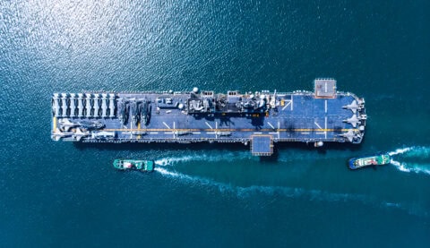 A satellite image of a nuclear aircraft carrier and a tender, illustrating how CATALYST INSIGHTS Horizon delivers rapid, reliable intelligence directly to marine and land agencies for faster, more accurate response operations.