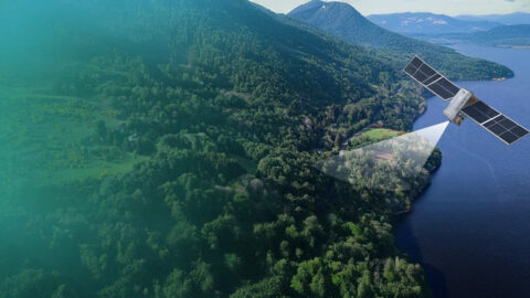 Image of a satellite scanning the ground in a forest area