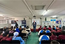 Speaker, speaking on stage