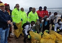 Douw Steyn and volunteers with Deputy Minister Narend Singh at Cutting beach