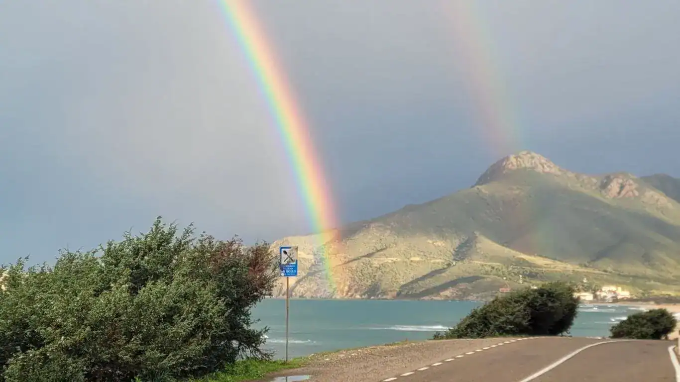 double rainbow in sardinia, italy