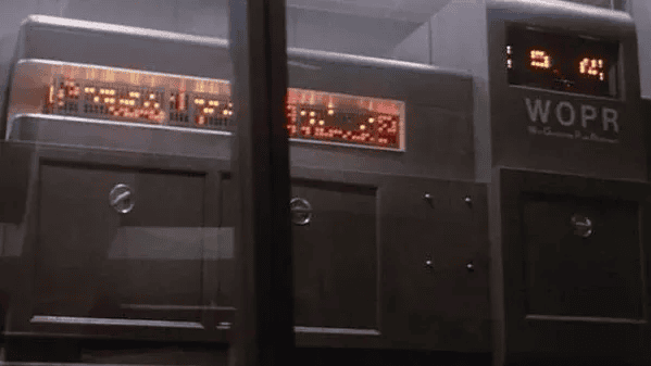 A close-up of a vintage WOPR computer console with illuminated red LED displays, representing retro technology and science fiction themes.