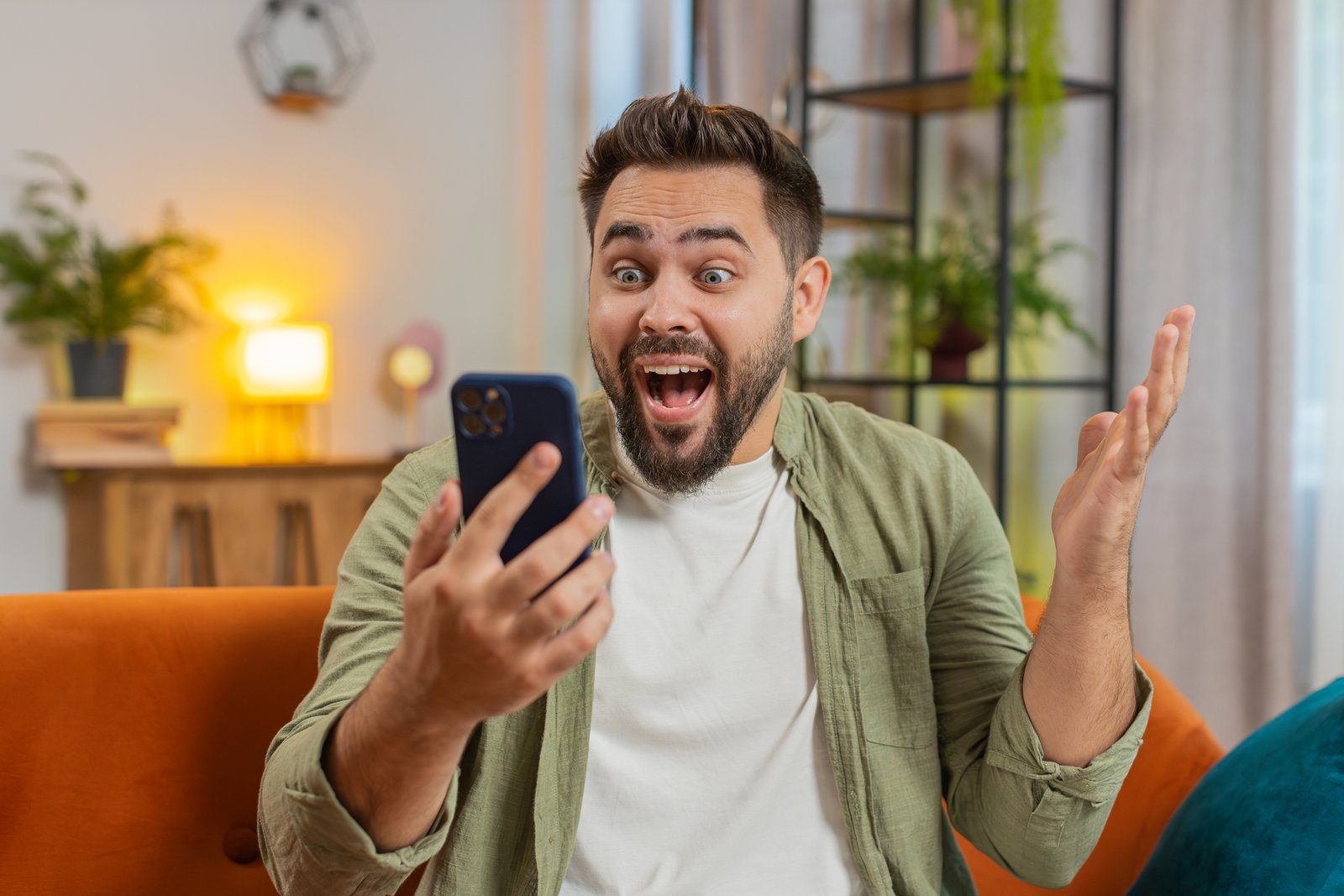 Man surprised by his phone.