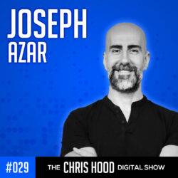 The Chris Hood Show Chris Hood, digital show host with a shaved head and beard, smiling confidently against a blue background, promoting SEO-focused digital marketing and podcasting strategies.