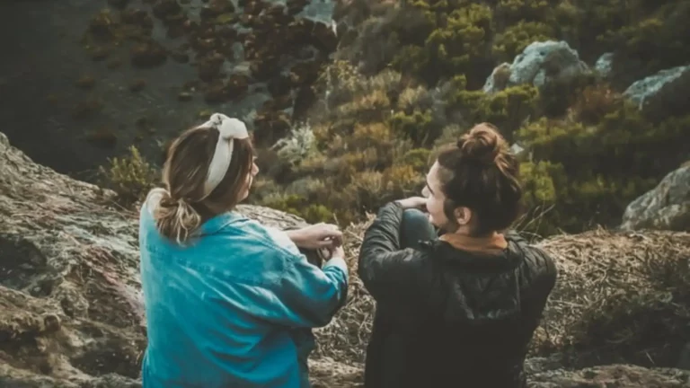Two Christian Women Talking To Each Other Looking Out From The Edge Of A Cliff At The Scenery Symbolizing How To Share Jesus And The Gospel