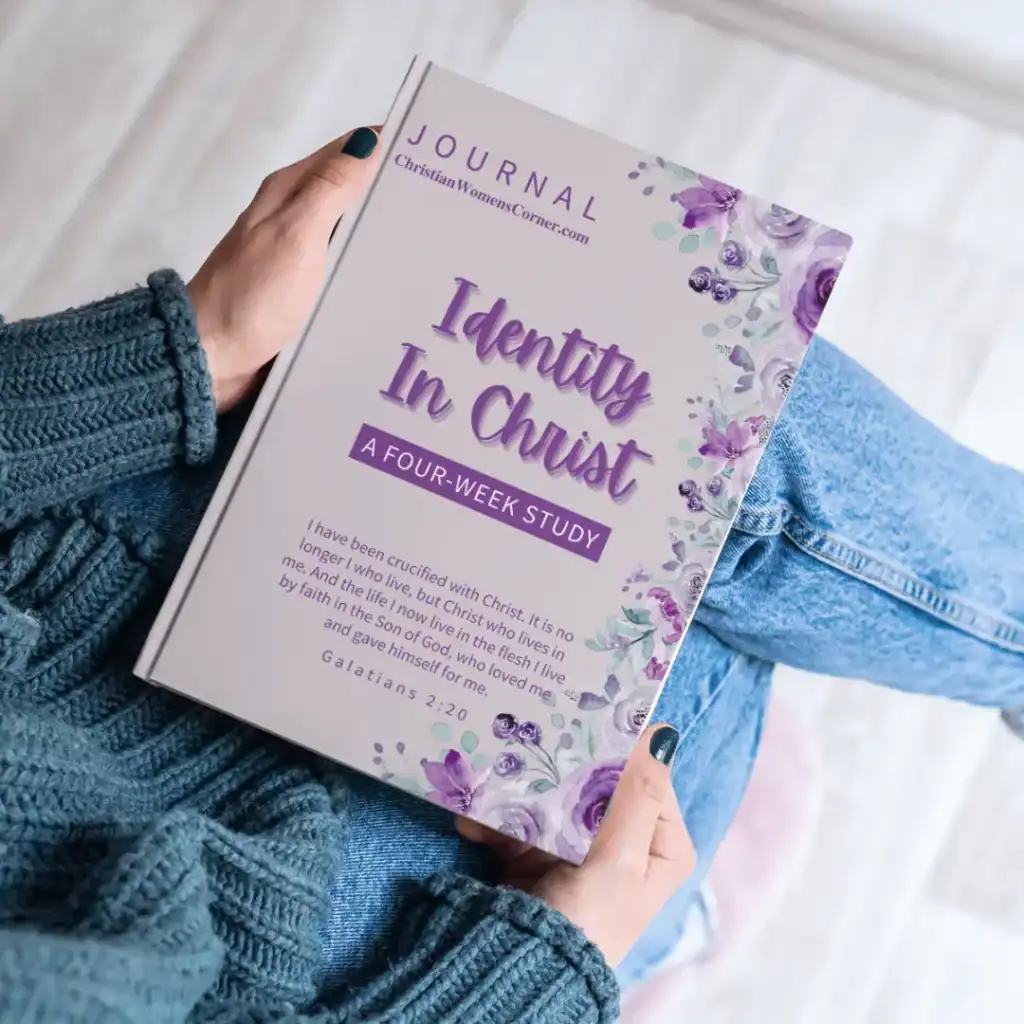 Woman holding an Identity in Christ journal on her lap