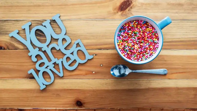 A "You Are Loved" sign on a table