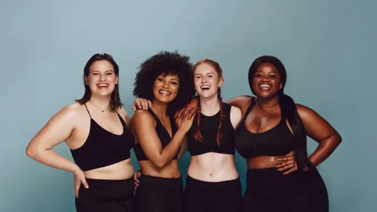 Four Christian women standing together and smiling symbolizing that your bodey is a temple