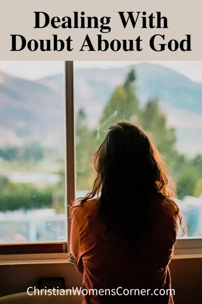 A woman looking out of a window.