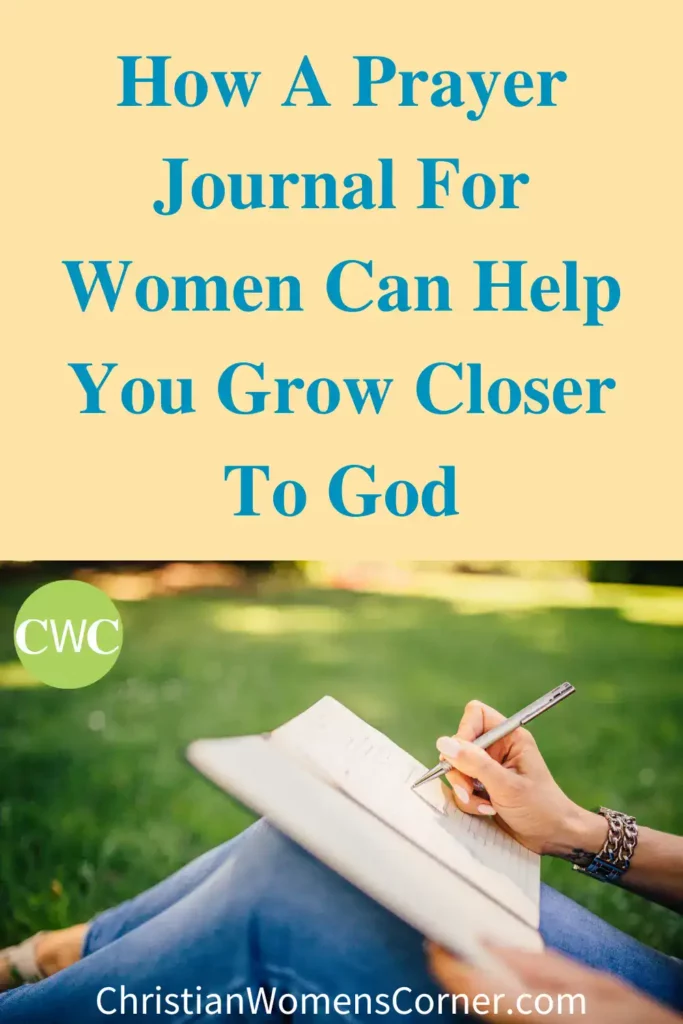 A christian woman writing in a prayer journal while sitting on the grass