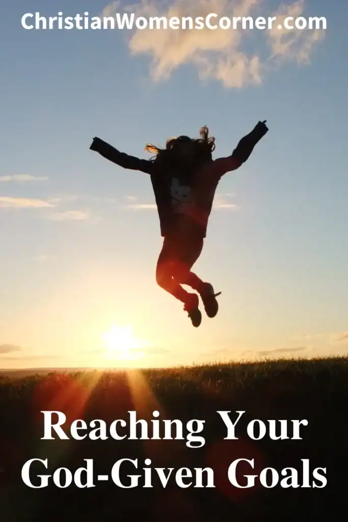 A woman jumping with her arms up in the air