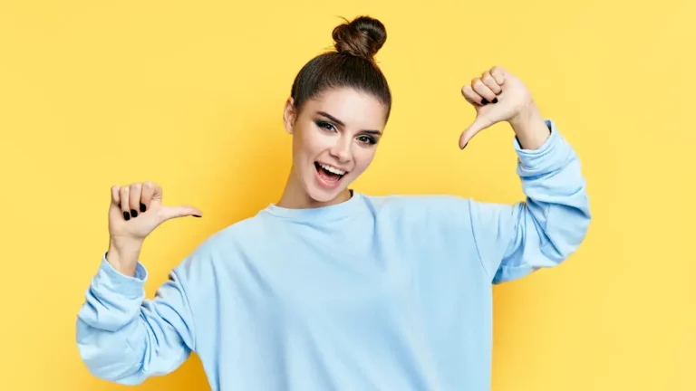 A Christian woman giving a thumbs up symbolizing overcoming pride