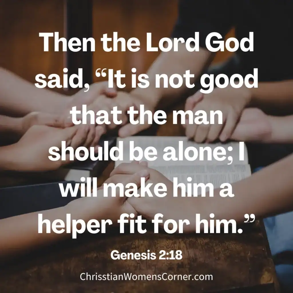 A group of people holding hands in a circle