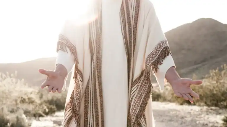Jesus standing with his arms open