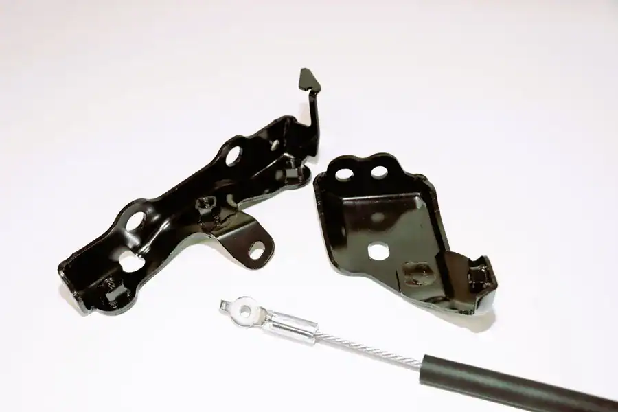 Black automotive metal brackets and cable, CHUHATSU North America, Inc. industrial auto parts, sturdy metal components for vehicle repair, heavy-duty automotive accessories, car parts manufacturer.