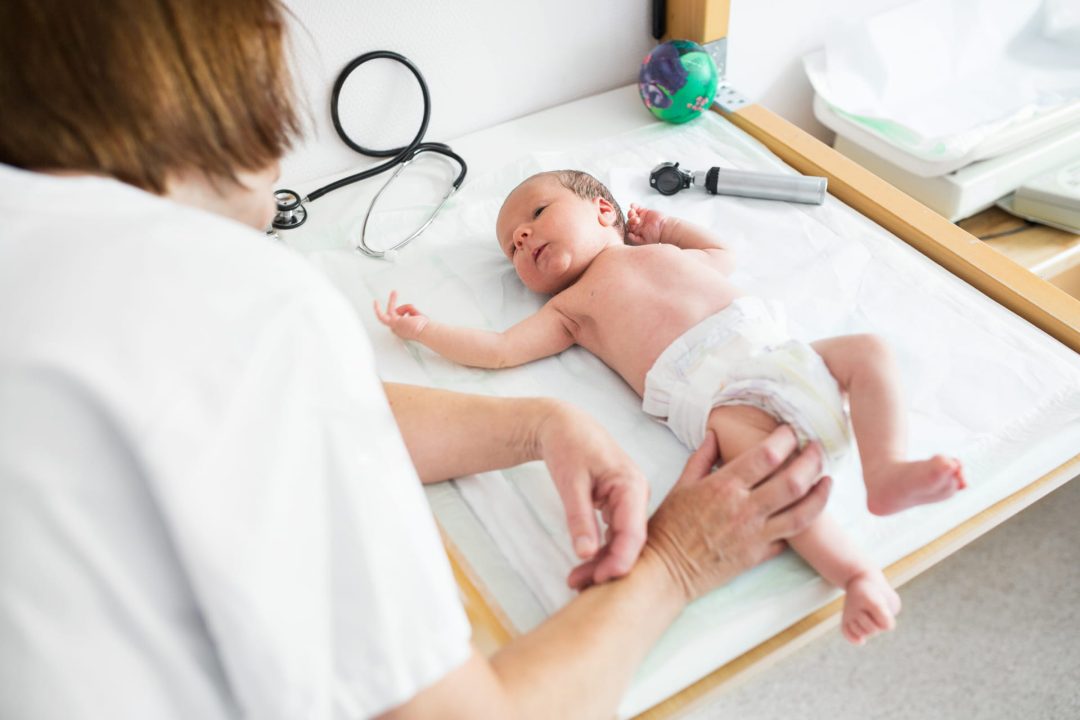 Pediatrician exam with newborn