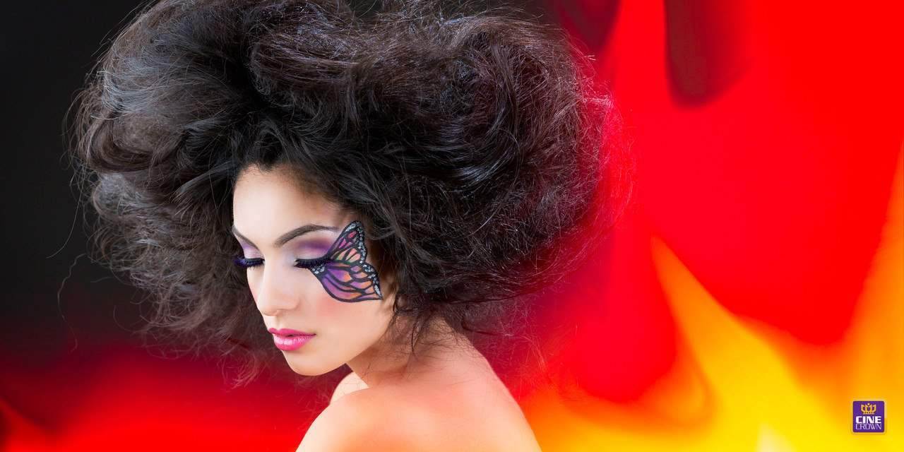 CineCrown glamour photography A woman with makeup and fire on her face.