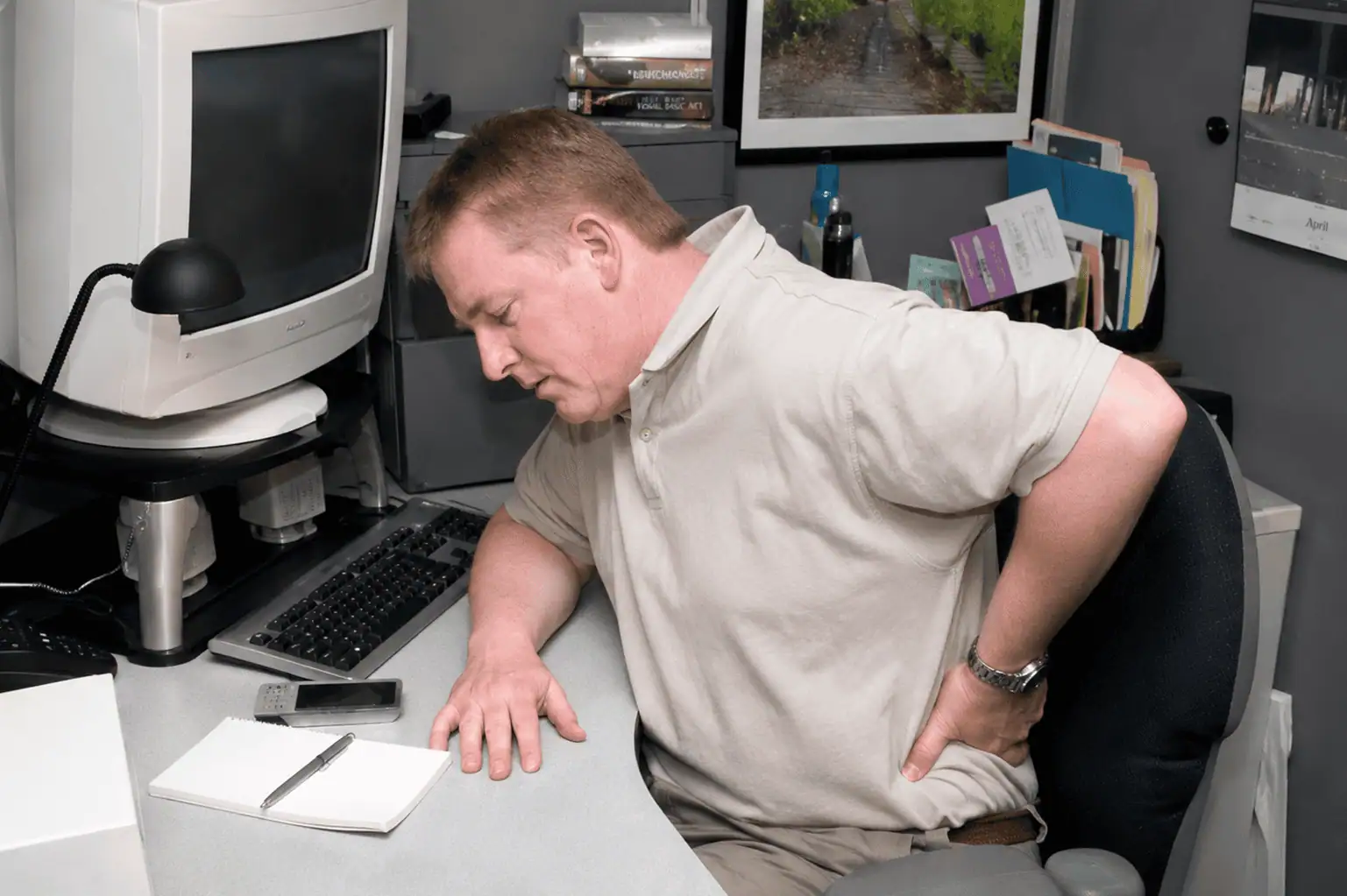 man holding hurt back