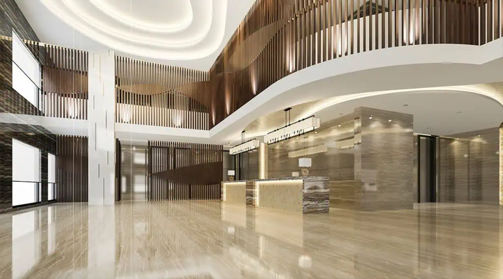 Modern hotel lobby with polished floors, stylish wood accents, and bright lighting, showcasing professional commercial cleaning services in Florida.