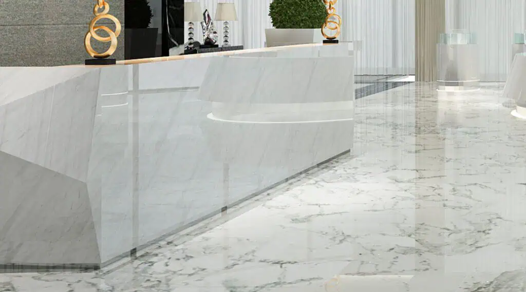 Reception area with sleek marble flooring and contemporary decor, showcasing professional commercial cleaning services in Florida.