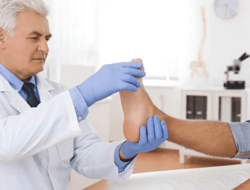 Orthopedic doctor examining a patient with leg length discrepancy