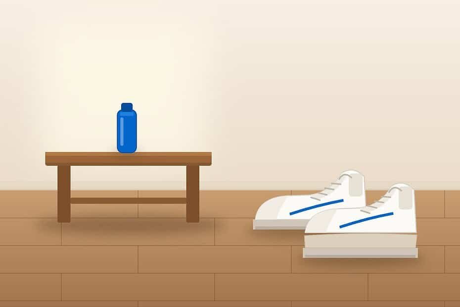 Getting used to a shoe lift: white walking sneakers, one with a built-in sole lift, beside a wooden bench with a blue water bottle in a home entryway