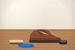 Shoe lift maintenance supplies: a modified shoe with a built-in sole lift on a wooden workbench next to a brush, polish tin and blue microfiber cloth