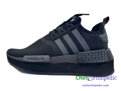 Shoe lift added to a men's black Adidas sneaker