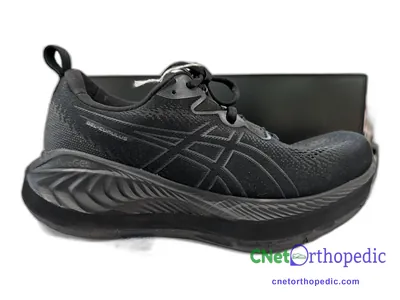 Shoe lift added to a men's black Asics sneaker