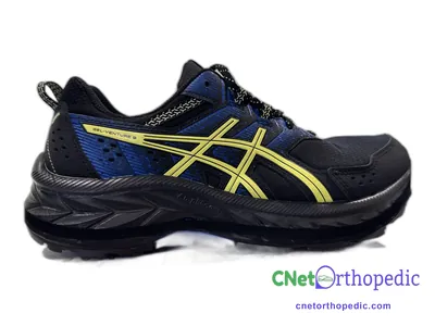 Shoe lift added to a men's black Asics sneaker