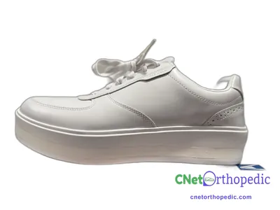 Shoe lift added to a women's white Converse sneaker