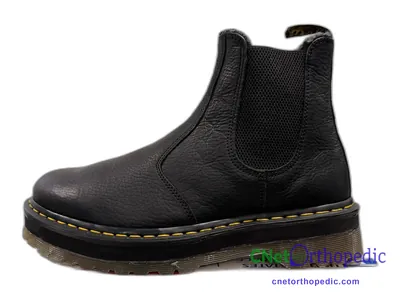Shoe lift added to a women's black Dr. Martens boot